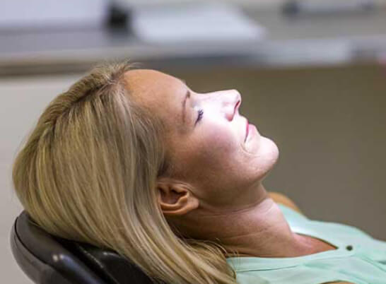 Woman relaxing in a dental chair